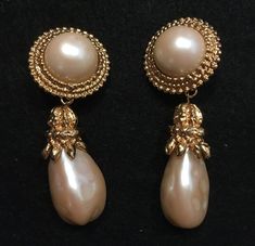 "Big Bold  Marla Buck Vintage Gold and Pearl Drop Clip Earrings-These Marla Buck show-stoppers were purchased  at Saks Fifth Avenue, NY. Round synthetic mabe`style pearls are surrounded by filligree gold rings from which dangles a long pearl with a gold tone cap. 3\" long 1 1/2 \" at widest If you are a Marla Buck collector, these are for you! Real stunners." October Jewelry, Vintage Gold Earrings, Pearl Jewels, Expensive Jewelry, Jewelry Essentials, Big Earrings, Vintage Pearls, Fantasy Jewelry, Girly Jewelry