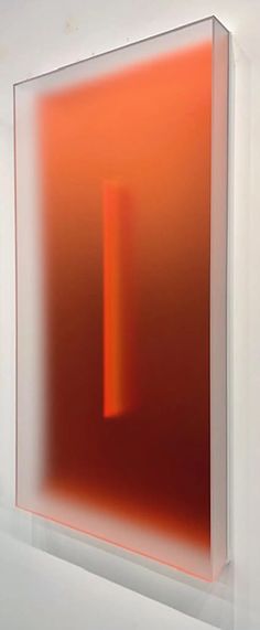 an orange and red abstract painting on a white wall