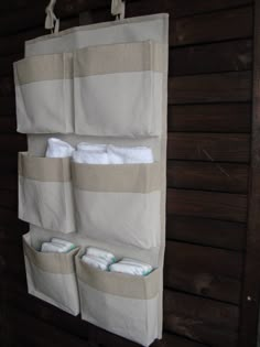 the hanging storage bag is filled with diapers