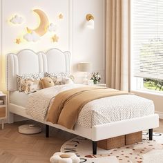 a white bed sitting in a bedroom next to a window