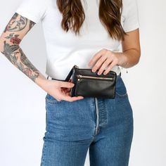 If you like to keep things simple and easy, the Minimalist Wallet is the all-in-one solution for you! The perfect size with a built-in wallet, you won't ever want to swap out your wallet again!Handcrafted in full-grain leather with solid brass hardware and comes with a build-in 5 card wallet and outside zipper pocket for small items. Complete with zipper closure.Ways To Wear Fits into all TAH Bags Use as a wallet with built-in 5 card pockets Inside pocket fits small iPhone Details Built-in 5 car Small Iphone, Minimalist Leather Wallet, Blush And Grey, Leather Artisan, Black Wallet, Minimalist Wallet, The Minimalist, Leather Cleaning, Leather Design