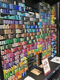 there are many different colors of crayons on display in the store and one is for sale