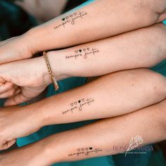 three people with matching tattoos on their arms