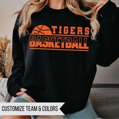 Custom Basketball Shirt, Basketball Team Shirt, Basketball Fan Shirt, Team Mom Gift, Custom Basketball Gift, Tigers Basketball Custom Team Name Custom Colors Short and Long Sleeve - Adult Unisex Fit Bella Brand Crewneck and Hoodie - Gildan Softstyle Unisex Fit (If you prefer one brand over another, just leave me a note at checkout) Matte designs will be DTF, Glitter will be HTV (vinyl) DTF About the print:  The design on this tee is DTF "direct to film" meaning the design is printed on film with special ink then cured and pressed onto the garment. The design will sit on top of the fabric, you will be able to feel the design but the design has a lot softer feel than vinyl but still with very vibrant colors. All materials used are high quality, professional grade.