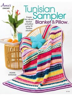 a magazine cover with a crocheted blanket and potted plant in the background