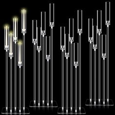 several different types of lights on display in front of a black background with white and yellow lighting