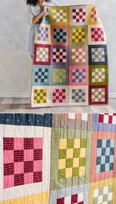 a woman is holding up a quilt made from squares and strips in different colors,