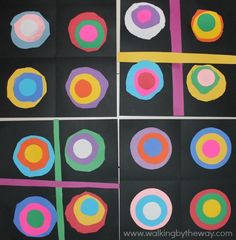 four different colored circles on black paper with white and yellow lines in the middle one circle has been cut into smaller circles