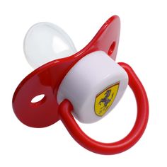 a red and white pacifier with a ferrari emblem on it's front end