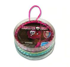 the monster high string is in a plastic container with pink and blue beads on it