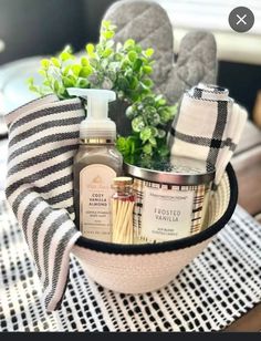 a basket filled with items sitting on top of a wooden table next to a potted plant