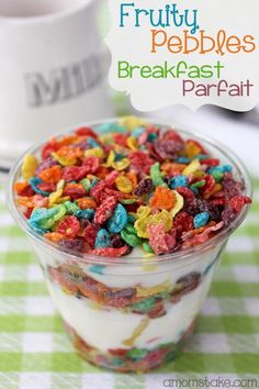 a bowl filled with cereal sitting on top of a green and white checkered table cloth