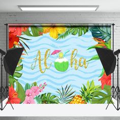 the backdrop for an event with tropical leaves and flowers