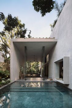 an indoor swimming pool in the middle of a house