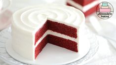 there is a red velvet cake with white frosting on the top and one slice cut out