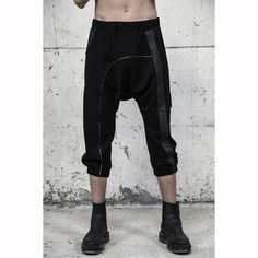 Introducing our avant-garde men's black loose pants, a fusion of style and comfort. Crafted with georgette and faux leather details, these unique pants redefine street fashion for men. Designed below the knee with a short length, these pants exude a dystopian, cyberpunk vibe, perfect for the fashion-forward man. Embrace the allure of the dark side and stand out from the crowd with these extraordinary pants. With three functional pockets - front, back, and side - these pants offer both fashion an Black Harem Pants With Pockets For Streetwear, Cyberpunk Style Baggy Black Bottoms, Cyberpunk Baggy Bottoms For Streetwear, Baggy Black Cyberpunk Bottoms, Baggy Cyberpunk Bottoms For Streetwear, Baggy Black Bottoms For Cosplay, Black Baggy Bottoms For Cosplay, Techwear Harem Pants, Baggy Techwear Harem Pants