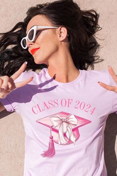 Coquette Class of 2024 Graphic T Shirts.Unisex Crew Neck Short Sleeve Tees.Crafted from premium materials, tailored to your lifestyle, ensuring a comfortable fit for any occasion.Family Group Uniforms Birthday Party Gift Concert Festival Events.High Quality Direct To Film Printed Graphic Design.100%COTTON,HEATHER(52%COTTON,48%POLY),ATH.HEATHER,BLACK HEATHER(90%COTTON,10%POLY)NICARAGUAMade In: Nicaragua Casual Cotton Tops For Graduation, Cotton Graphic Print Shirt For Graduation, Cotton Letter Print Top For Graduation, Cotton Crew Neck Top For Graduation, Relaxed Fit Crew Neck Top For Graduation, Custom Print Cotton Tops For Graduation, Graphic Tee Tops With Graphic Print For Graduation, Graphic Tee Crew Neck For Graduation, Casual Short Sleeve Tops For Graduation