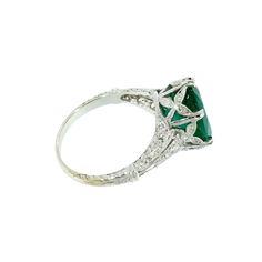 A Timeless Emerald ring… A fine example of Art Deco jewelry in its entire splendor! Ideal to be worn alone or as a lovely alternative Vintage Engagement Ring. A Family Heirloom Quality Keepsake, to have and to hold Forever! The oval Emerald is GIA certified, weighing 4.43 caratThe setting is handcrafted in 18K White Gold to fit a finger size 6.5 Hallmarked Oval Emerald Ring In Platinum, Oval Hallmarked Emerald Ring In Platinum, Luxury Oval Emerald Ring Collectible, Oval Platinum Emerald Ring With 17 Jewels, Platinum Oval Emerald Ring With 17 Jewels, Art Deco Oval Emerald Ring With Brilliant Cut, Vintage Platinum Ring With Gemstone, Vintage White Gold Oval Cabochon Ring, Heirloom Style Oval Diamond Ring With 17 Jewels