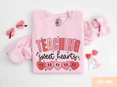 Valentines Day Teacher Sweatshirt, Teaching Sweethearts Teacher Shirts, Teacher Valentines Day Gift,Love Teacher Shirt,Valentines Day Shirt *PRODUCTION TIME* 1-6 days (Usually 2 days) *SHIPPING TIME* 2-5 days *PRODUCT DESCRIPTION* *Bella Canvas Unisex T-shirt Super soft cotton and excellent quality print makes. 100% Soft cotton (fibre content may vary for different  colors) Light fabric (4.2 oz/yd² (142 g/m Runs true to size Retail fit Our Relaxed Fit Tee (Bella + Canvas style 3001) is a  unisex style  that runs a touch small for men, and  about a half a size large for women. It's a relaxed fit  and is soft and cozy. *Unisex Sweatshirt 50% cotton, 50% polyester Loose fit Runs true to size Sewn-in label *CARE INSTRUCTION* Machine wash: warm (max 40C or 105F); Non-chlorine:  bleach as needed Long Sleeve T-shirt With Heart Graphic For Gift, Cute Valentine's Day Graphic Print Sweatshirt, Valentine's Day Long Sleeve T-shirt With Letter Print, Long Sleeve Letter Print T-shirt For Valentine's Day, Long Sleeve T-shirt With Letter Print For Valentine's Day, Valentine's Day Gift Top With Long Sleeves, Cute Long Sleeve T-shirt For Valentine's Day, Valentine's Day Pink Sweatshirt With Letter Print, Valentine's Day Pink Letter Print Sweatshirt