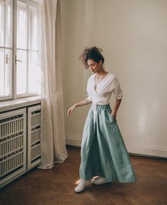 ♠ Nothing more feminine than this rich bohemian style skirt that is made of 100% pure linen. This flared midi skirt has a high rise, a waistband and side pockets. Pictured in a dusty turquoise shade here, this bohemian linen piece is available to order in multiple colors. ♠ Sizes The model on the picture is 165 cm/5'5" tall and is wearing size S. Have a look at my Size Chart below to make sure your piece will fit you best. ** Custom Orders For any changes or adjustments you may need, please cont Bohemian High Waist Lined Maxi Skirt, Bohemian Maxi Skirt With Elastic Waistband And Voluminous Fit, Bohemian Midi Skirt With Elastic Waistband, Bohemian Voluminous Maxi Skirt With Elastic Waistband, Spring Bohemian Style Gathered Skirt Bottoms, Bohemian High Waist Maxi Skirt With Elastic, Bohemian High Waist Maxi Skirt With Elastic Waistband, Spring Bohemian Gathered Skirt Bottoms, Bohemian Voluminous Tiered Skirt Bottoms