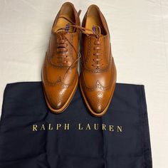 Ralph Lauren Purple Label Sully Lace Up Oxfords Loafers Dress Shoes: 39.5b Made In Italy. Offers Are Welcome. Please Check The Please Check The Measurements In The Photos. Moreover The Manufacturer Measurements Can Be Seen In The Pictures. Ralph Lauren Purple Label Sully Lace Up Oxfords Loafers Dress Shoes Wing Tip: 39.5b Made In Italy Brown Cognac Tapered Toe Leather In Excellent Condition Size 38.5 B, Which Equates To ~7.5 Us Sizing But Please Confirm Measurements I Include In Pictures And Do Designer Goodyear Welted Oxfords For Office, Luxury Wingtip Lace-up Shoes For Office, Luxury Office Lace-up Wingtip Shoes, Designer Oxfords With Brogue Detailing For Business, Designer Brogue Oxfords For Business, Semi-formal Oxford Loafers With Almond Toe, Luxury Wingtip Oxfords For Work, Designer Wingtip Oxfords For Work, Designer Wingtip Oxfords For Business