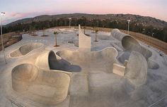 an aerial view of a skate park with ramps