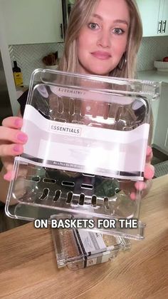 a woman holding up a clear plastic container