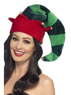 a woman wearing a green and red elf hat