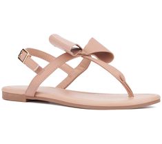 Elevate your summer wardrobe with the Abril flat sandal, where comfort meets effortless chic style. Adorned with textured bow details for a touch of femininity, this sandal is perfect for everything from beach days to casual strolls around town. From New York & Company. Trendy Beach Sandals With Bow, Trendy Spring Sandals With Bow, Trendy Bow Sandals For Spring, Casual Summer Flip Flops With Bow, Trendy Bow Sandals For Summer, Trendy Summer Sandals With Bow, Flat Bow Sandals For Spring, Adjustable Bow Sandals For Beach, Summer Beach Flip Flops With Bow