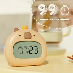 an alarm clock sitting on top of a table