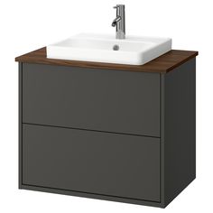 a bathroom sink sitting on top of a wooden cabinet next to a faucet