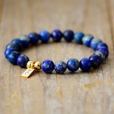 The Handmade Natural Lapis Lazuli Beaded Bracelet with a Gold Plated Tag looks great. It will make the perfect gift 🎁 for someone special, or treat yourself as you deserve it 💖 🥰 These Bracelets have been made using high quality Natural Lapis Lazuli and have a Gold Plated Tag with MC for MantraChakra. They are available as 4mm, 6mm and 8mm. Lapis Lazuli brings out your inner priestess, heightens inner-vison and deepens wisdom. It benefits the Throat Chakra with communication and expression of Lapis Lazuli Beaded Bracelets With Gemstone, Gift Lapis Lazuli Beaded Bracelets With Polished Beads, Lapis Lazuli Beaded Bracelets As Gift, Lapis Lazuli Bead Bracelet Gift, Lapis Lazuli Gemstone Beaded Bracelet For Gifts, Lapis Lazuli Gemstone Beaded Bracelets, Lapis Lazuli Gemstone Beads Bracelet For Gift, Gift Lapis Lazuli Round Bead Bracelets, Gift Lapis Lazuli Bracelets With Round Beads