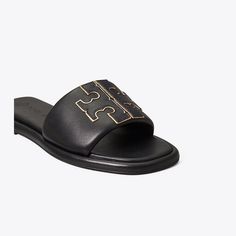 Chic comfort. The sport slide is made of soft padded leather that hugs the foot, with a cushioned foam insole for flexible support. The raised Double T is edged in metallic trim for subtle shine. Tory Burch Slides, Soft Sandals, Miller Sandal, Square Toe Sandals, Leather Thong Sandals, Wide Shoes, Navy Gold, Footwear Design Women, Designer Sandals