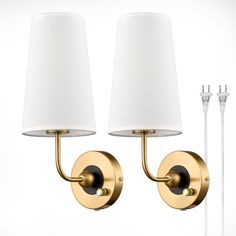 two lamps are next to each other on the wall