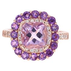 Amethyst and Diamond Cocktail Ring! Playful yet Powerful! Its like having a piece of glittery candy on your finger! This ring has a light purple Cushion Cut Amethyst that weighs 2.29 Carats and is embellished with 16 Amethysts that weigh 0.87 Carats as well as 32 Round Cut Diamonds that weigh 0.40 Carats. The total carat weight of the ring is 3.56 Carats. The Amethyst has a gorgeous light purple hue and measures at 8 mm x 8 mm. The ring is crafted in `14 Karat Rose Gold and weighs approximately Rose Gold Cocktail, Purple Cushion, Purple Cushions, Gold Flower Ring, Amethyst And Diamond Ring, Diamond Cocktail Ring, Vintage Jewelry Art, Gold Cocktail Ring, Purple Jewelry