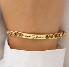 Introducing our Personalized 18K Gold Plated Bracelet - the perfect unisex accessory that captures the essence of life's most precious moments. Whether you're commemorating the birth of a child or celebrating a cherished anniversary, this bracelet is designed to be both meaningful and stylish. The custom engraving of a name, a significant date, and a charming baby symbol makes this piece a unique and sentimental treasure. Crafted with precision, this bracelet features a premium 18K gold plating Rectangular Engraved Gold Bracelet Gift, Formal Engraved Gold Chain Bracelet, Classic Gold Name Bracelet With Engraving Option, Customized Gold Minimalist Name Bracelet, Customized Minimalist Gold Name Bracelet, Minimalist Gold Nameplate Bracelet, Engraved Yellow Gold Plated Bracelets, Engraved Yellow Gold-plated Bracelets, Yellow Gold Rectangular Name Bracelet As Gift