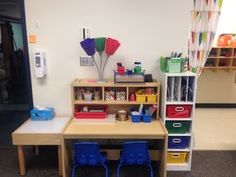 two children's desks and chairs in a room