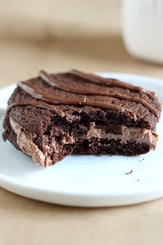 two pieces of chocolate cake on a white plate