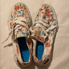 White Slip On Sneakers With Floral Print. Brand New Never Used. Trendy Floral Print Sneakers For Spring, White Flat Canvas Shoes For Spring, Floral Print Canvas Shoes For Summer, White Casual Sneakers For Beach, Comfortable Floral Print Sneakers For Spring, Casual White Sneakers For Beach, White Low-top Sneakers For Vacation, Casual White Sneakers For Vacation, White Sneakers For Spring Vacation