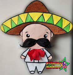 a paper mache with a mexican hat and mustache