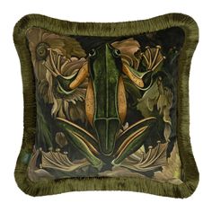 a decorative pillow with an image of a frog on it's face and two other animals in the background