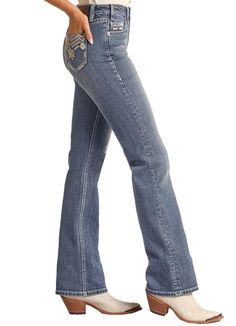 Rock & Roll Cowgirl's jeans are the ideal style choice for everyday wear. Constructed of sturdy fabric with a high-rise waist and bootcut leg, these jeans are designed for a flattering fit. The medium wash gives a vintage look, while the leather aztec embellishment on the back pocket adds a stylish touch. Easy to care for with a hand wash cold and hang to dry design. High Rise Bootcut Medium Vintage Wash Hand Wash Cold Hang to Dry Western Style Dark Wash Mid-rise Flare Jeans, Western Style Mid-rise Dark Wash Flare Jeans, Western High Rise Fitted Flare Jeans, Western Style Fitted High Rise Flare Jeans, Fitted High Rise Western Flare Jeans, Western Mid-rise Denim Blue Jeans, Western Style Denim Bottoms For Fall, Western Style Medium Wash Mid-rise Bottoms, Medium Wash Mid-rise Western Bottoms