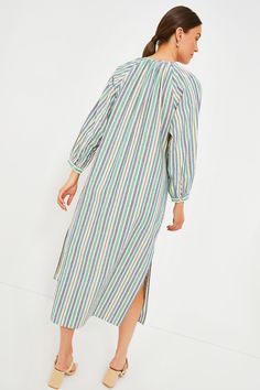 Equal parts effortless and elevated, the Zephyr Stripe Heidi Dress is a warm-weather staple. The straight, maxi silhouette boasts long blouson sleeves with button cuffs, a partial front button placket, and side slits for easy movement. Pair with sandals and a tote or elevated with heels and a clutch! Round neckline Gathering along neckline Long blouson sleeves with button cuffs Partial front button placket Relaxed straight silhouette Side slits Maxi length Material: 100% Cotton Care: Hand wash c Spring Daywear Maxi Dress With Elastic Sleeves, Long Sleeve Maxi Dress With Button Cuffs For Daywear, Bishop Sleeve Maxi Dress For Daywear, Long-sleeved Maxi Dress With Gathered Sleeves For Vacation, Long Sleeve Maxi Dress With Gathered Sleeves For Vacation, Long Sleeve Midi Dress With Gathered Sleeves For Vacation, Relaxed Fit Long Sleeve Maxi Dress For Daywear, Spring Midi Dress With Blouson Sleeves For Daywear, Casual Spring Maxi Dress With Button Cuffs