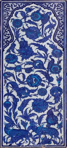 an intricately designed blue and white tile