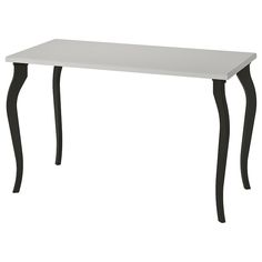 a white table with black legs on a white background