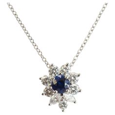 Finely detailed pre owned Tiffany & Co Victoria necklace, crafted in 950 platinum. 9 round brilliant and marquise cut diamonds total an estimated 0.53 carats (estimated at F-G color and VVS clarity). The round cut sapphire measures 4mm and is estimated at 0.30 carats. The gemstones are in excellent condition and free of cracks or chips. The stylish necklace is a retired piece and no longer available for sale at Tiffany & Co. The necklace is in excellent original condition. Particulars: Weight: 3 Stylish Necklace, Marquise Cut Diamond, Sapphire Pendant, Tiffany And Co, Marquise Cut, Tiffany & Co., Round Brilliant, Chains Necklace, Round Cut