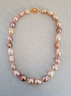 "This is a gorgeous pink white purple baroque pearl necklace made with 100 % natural cultured pearl and 18 kt yellow gold plated on sterling silver. Necklace Length: 17 \" Baroque Pearl: 15x15 to 12x12mm Italian made 925 Sterling Silver Clasp: 18mm The necklace is a beautiful statement piece with personality and really stands out. It is absolutely stunning and attractive. And it is easy to wear in any occasion. Pearl is the birthstone of june. Overtime, pearl has become the symbol of purity.   Please feel free to message me if you want to see more photos or make any modifications on the necklace. International Buyers Please Pay Attention: Import duties, taxes, and charges are not included in the item price or shipping cost. These charges are the buyer's responsibility. Please check with yo Pearl Necklace Pink, Pink Pearl Necklace, Jewellery Bridal, Baroque Pearl Necklace, Pearl Jewellery, Purple Pearl, June Birthstone, Bridal Jewellery, Lovely Earrings