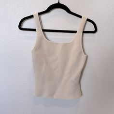 Aritzia Sculpt Knit Crop Tank. Size Medium. Color Is Matte Pearl. Brand New. Never Worn. Fitted Cream Knit Tank Top, Beige Seamless Knit Top, Seamless Beige Knit Top, Knit Crop, Knit Crop Top, Puff Sleeve Top, Grey Long Sleeve, Black Crop Tops, Cropped Sweater