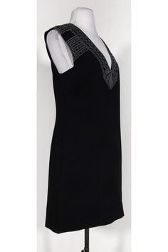 This shift dress is instantly elevated with a mirror and silver embroidery design at the shoulders. The perfect cocktail dress for a dinner date, pair it with silver pumps to complement. Size S 77% triacetate, 23% polyester Concealed back zipper Lined interior Geometric mirror embellishment at shoulders Silver embroidered design at shoulders Shift silhouette Above knee Bust 34" Shoulder to hem 34" Embellished Sheath Mini Dress For Formal Occasions, Formal Embellished Sheath Mini Dress, Dress For A Dinner, Geometric Mirror, Max Dress, Perfect Cocktail Dress, Silver Embroidery, Silver Pumps, Bcbg Max Azria