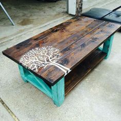 a coffee table with a tree painted on it